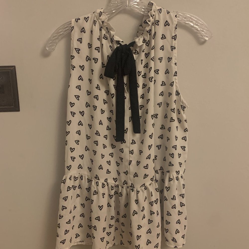 White top with black heart pattern